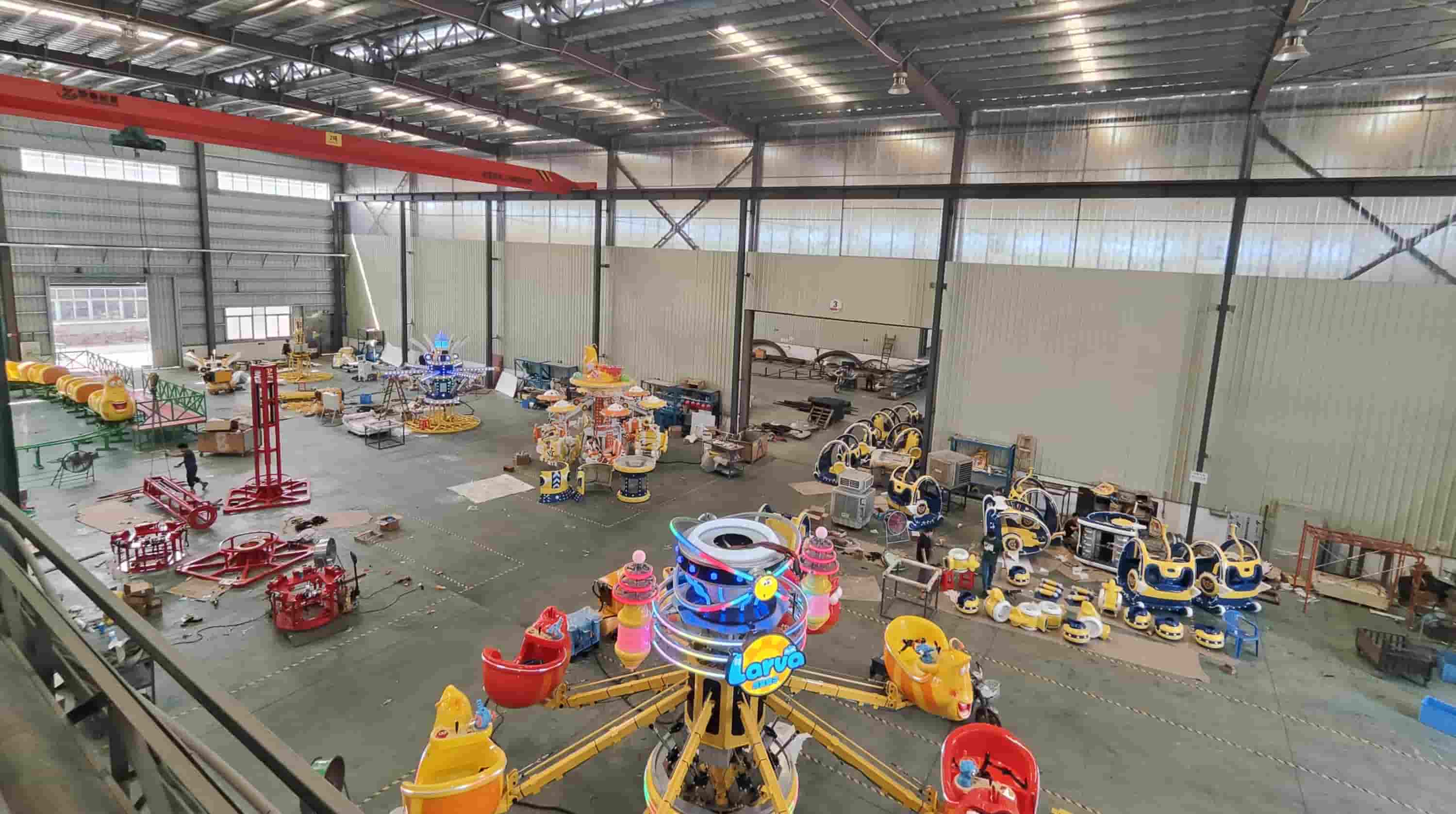 Illustrative production floor with amusement ride units